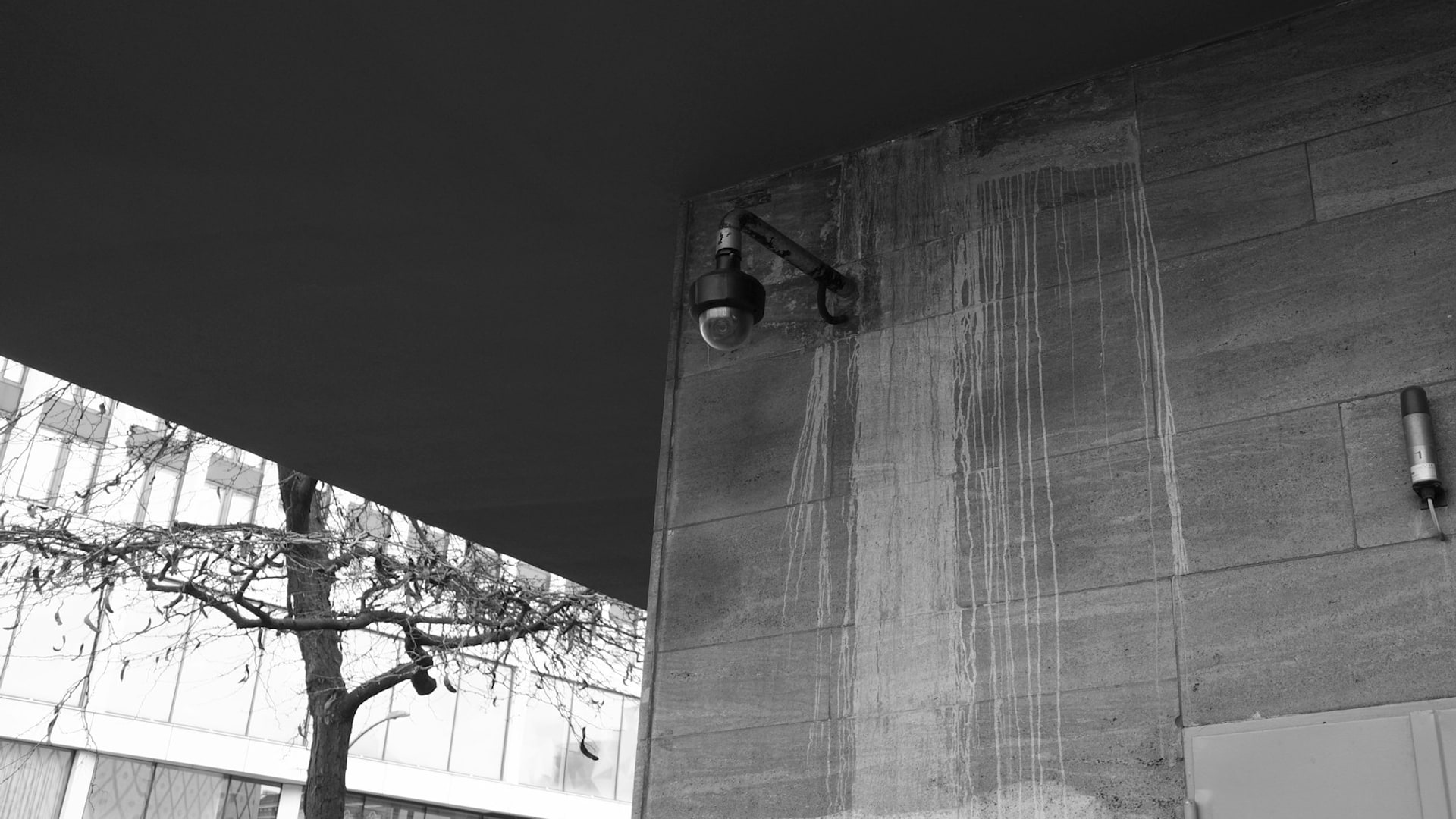 Warehouse perimeter at night with infrared CCTV and security lighting